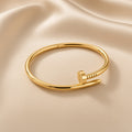 Golden Nail Cuff ( Premium high-grade stainless steel with golden plating )